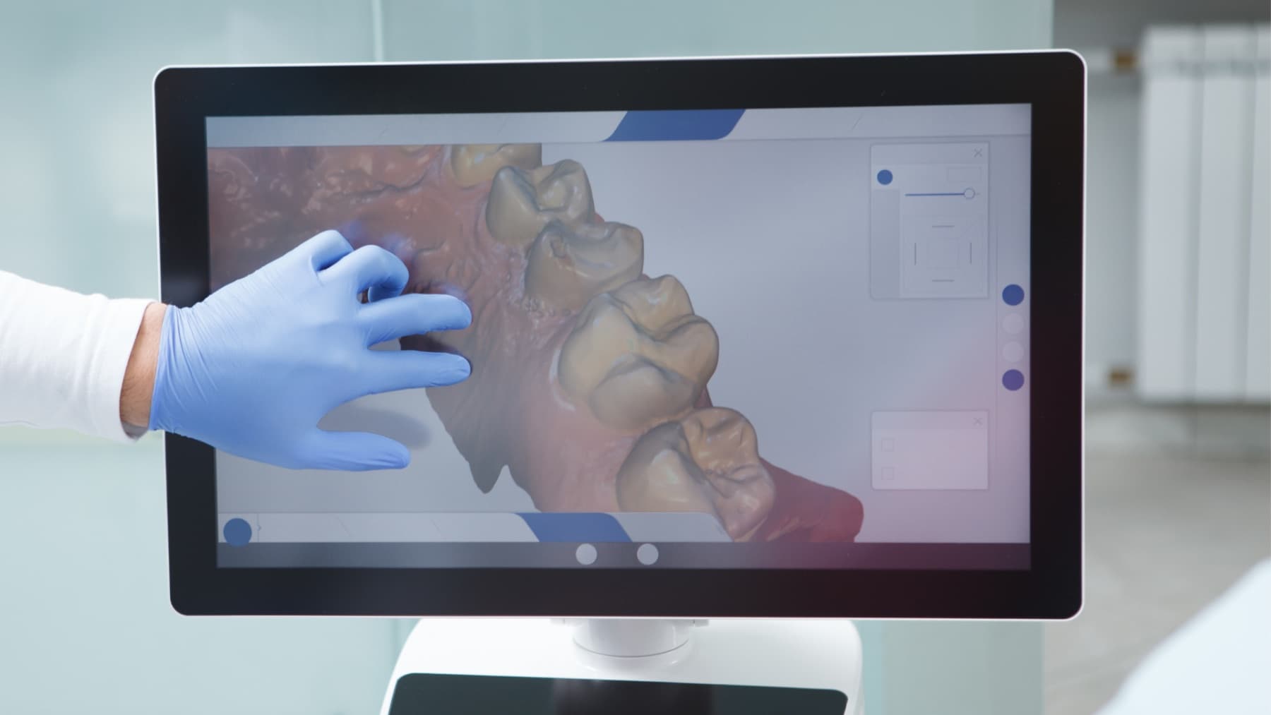 A clinician working through a 3D scan of a patient’s mouth at the Studio